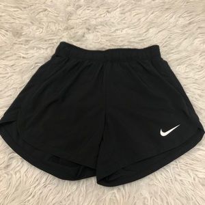 Black Nike shorts.